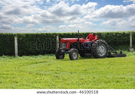 tractors cutting grass