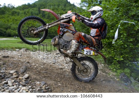 SIBIU, ROMANIA - JUNE 14: Erwin Kovacs competing in Red Bull ROMANIACS Hard Enduro Rally with a KTM EXC motorcycle. The hardest enduro rally in the world. June 14, 2012 in Sibiu, Romania.