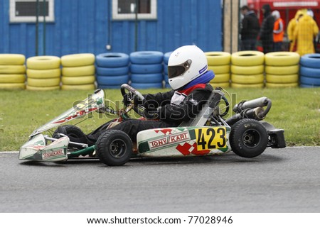 BUCHAREST, ROMANIA - MAY 8: Razvan Popiel competes in South East European Karting Zone Championship on MAY 8, 2011 in Bucharest, Romania.