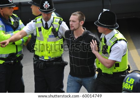 BRADFORD, WEST YORKSHIRE – AUG 28 : Police clash with EDL (English Defence League) supporters and Islamic protesters during a supposed peaceful demonstrations August 28, 2010 in Bradford, England