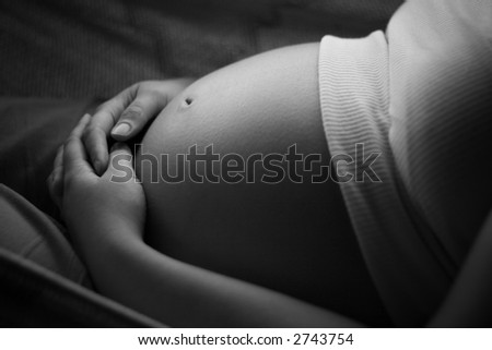 Pregnant tummy laid down on a hammock (black and white)
