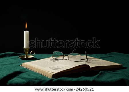 Old book and candle