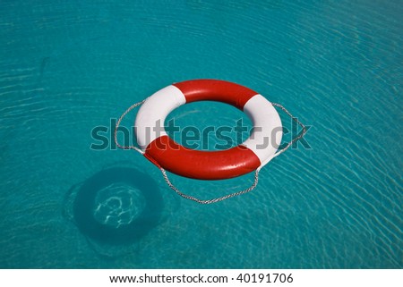 Life buoy floating in swimming pool