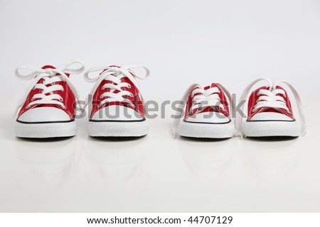 Red Shoes isolated on white. Big Brother - Concept.