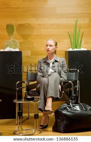 business woman waiting in office lobby