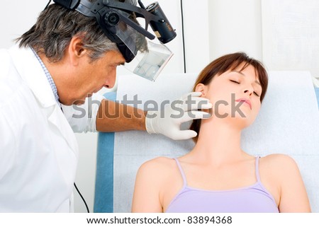 man doctor visit a young caucasian woman cosmetic surgery