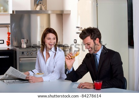 Couple having breakfast before going to work