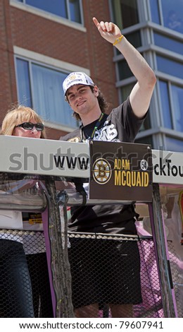 BOSTON, MA, USA - JUNE 18: Adam Mcquaid celebrates the Stanley cup victory at the Boston Bruins parade after winning the cup for the first time in 39 years, June 18, 2011 in Boston, MA, United States