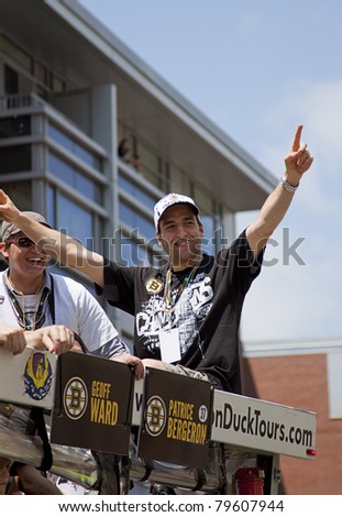 BOSTON, MA, USA - JUNE 18: Patrice Bergeron celebrates the Stanley cup victory at the Boston Bruins parade after winning the cup for the first time in 39 years, June 18, 2011 in Boston, MA, United States