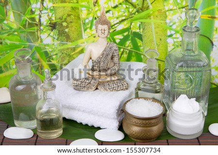 Buddha figurine with body care products