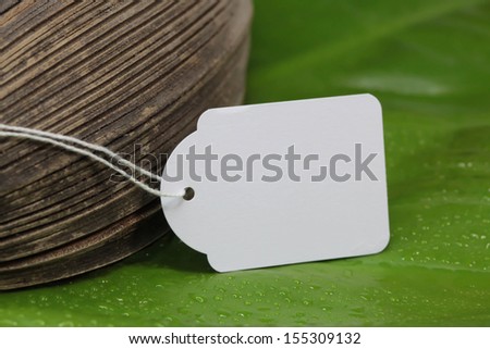 Blank tag on a string - white natural label with wood and green