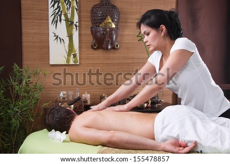 Thai woman making massage to a man