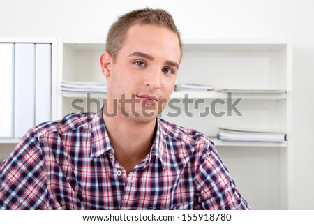 Portrait of man wearing checked shirt