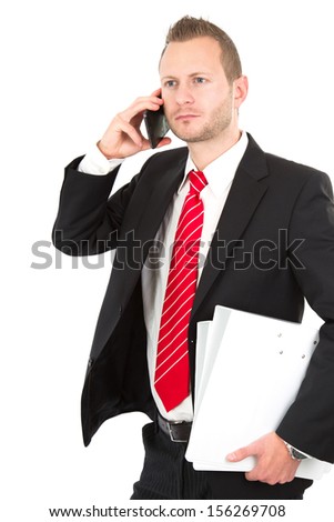 Three quarter length of businessman phoning
