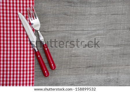 Knife, spoon and fork on wooden background for christmas, birthday, valentine\'s day, mother\'s day or for a greeting card - bavarian food or invitation