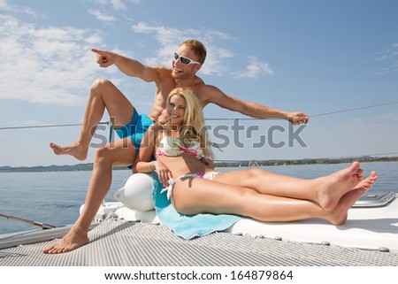 Young couple in love on summer holiday on the sea - holiday, sailing trip.