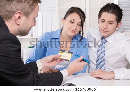 Young couple in a meeting - insurance or bank