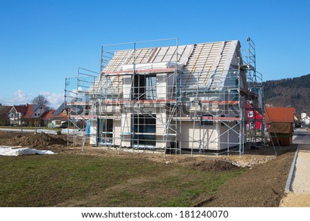 Construction of a new prefabricated house of stone and wood.
