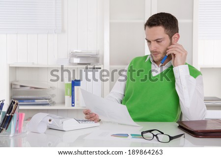 Unhappy businessman sitting concerned and frustrated in the office.