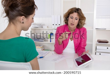 Job interview or business meeting under two woman.