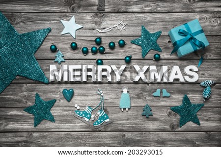 Merry christmas letters in white with turquoise decoration for advent. Idea for a greeting card.
