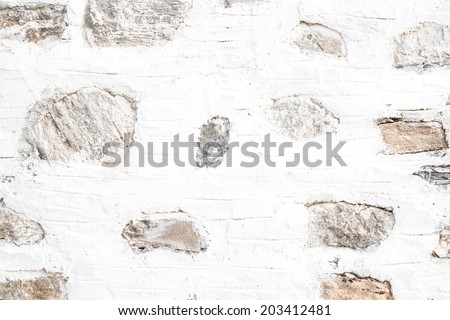 Natural wall with white and grey stones in shabby chic for a background.