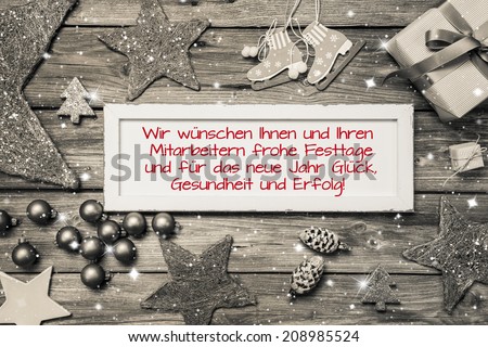 Greeting card for christmas with german text for merry christmas. Idea for employees and customers in red font.