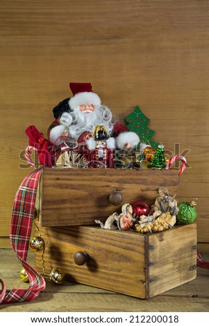 Old christmas toys: vintage decoration idea for advent on wooden background with a Santa.