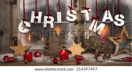 Romantic christmas card in red and white colors with candles in the window.