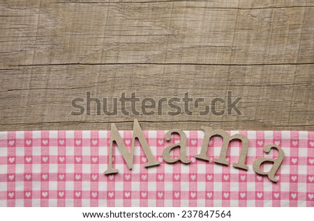 Wooden mothers day background with text mum in german language.