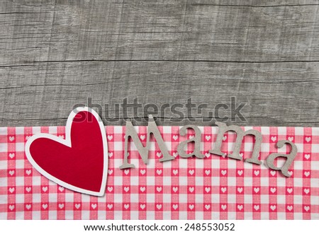Red heart with paper letters \'Mama\