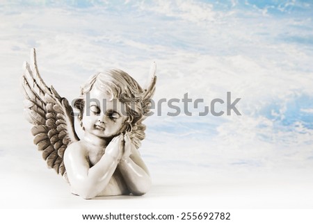 Sad angel on a background for a greeting card.