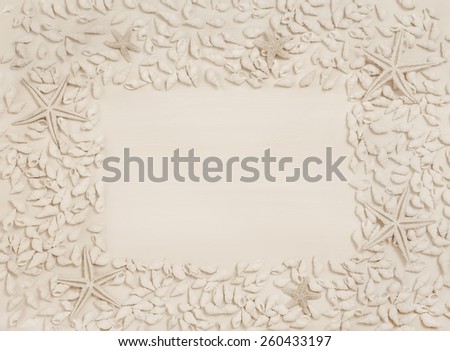 Tropical summer: blue or turquoise wooden background with shells and starfishes.