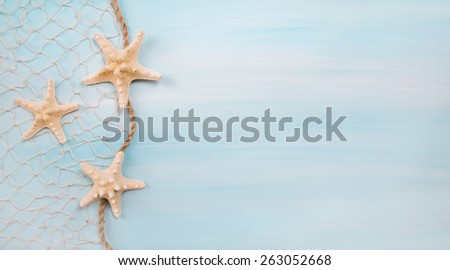 Blue turquoise background with starfishes or shells.