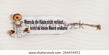 German slogan on a wooden sign with anchor with the text: if you don\'t leave coasts you can not discover the oceans. Concept for courage.