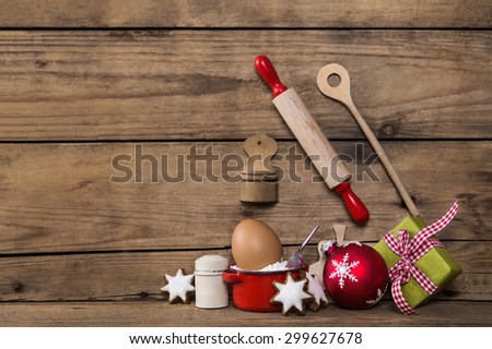 Baking in christmas time. Wooden background with kitchen utensils for cookies and cakes.