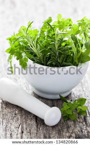 mixed herbs in a mortar