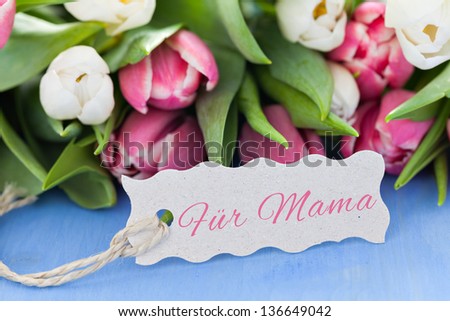 Flowers and tag for mothers day with german text fÃ?Â¼r mama