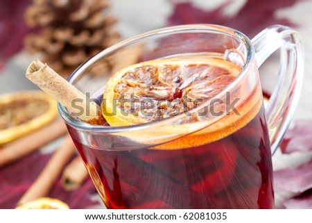 spiced wine color. stock photo : closeup of a glass with hot spiced wine