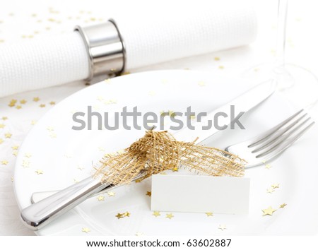 christmas place setting with name tag and cutlery