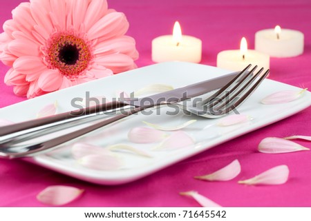 stock photo table setting with candles and flower in pink for mothers day