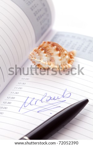 holiday written in a planner isolated on white background