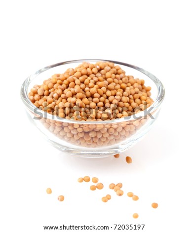 yellow mustard seeds isolated on white background