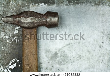 Old Hammer on metal background