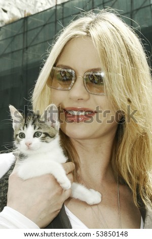 stock photo ROME MAY 31 Italian actress Anna Falchi and a kitten