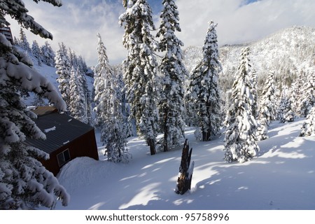 Mountain cottage buried in a mountain of snow after a winter blizzard near Lake Tahoe California/Nevada
