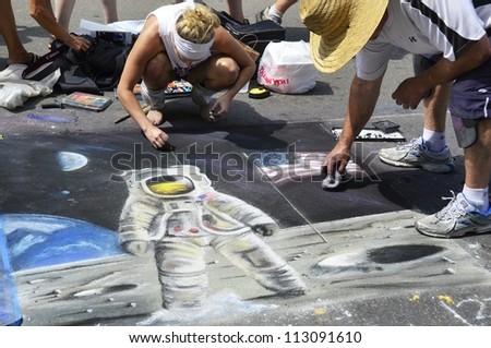 RALEIGH, NC, USA - SEPTEMBER 15: ArtSpark\'s street painting festival in Fayetteville street attracted a big crowd on September 15, 2012 in Raleigh, NC, USA