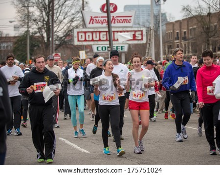 Raleigh - February 8: The 10th Krispy Kreme Challenge Has Raised $200.000 For The Children\'S Hospital, On February 8, 2014 In Raleigh, Usa. The Rules Are Run 2,5 Miles, Eat 12 Donuts And Run 2,5 Miles