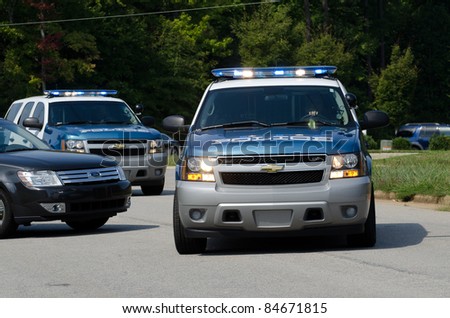 APEX, NC, USA - SEPTEMBER 14: Security checks the surroundings before President Barack Obama arrives at West Star company on September 14, 2011 in Apex, NC, USA