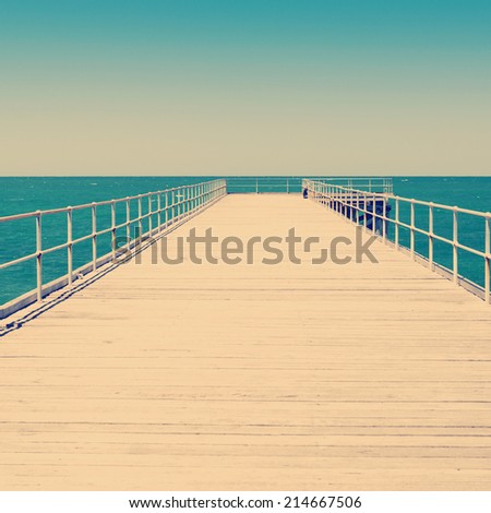 Long wooden jetty stretches out into clear water at Stenhouse Bay, South Australia